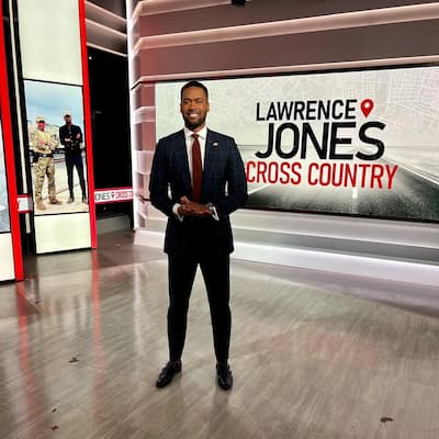 Lawrence Jones as the Host of Cross Country