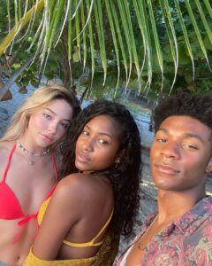 Carlacia Grant together with her co-starsJonathan and Madeline filming Outer Banks season 3